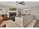 Cozy living room with a brick fireplace, modern TV, and comfortable furnishings at 1310 Yarborough Dr, Peachtree City, GA 30269