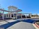 Modern school entrance with covered walkways, featuring contemporary architecture and a well-maintained landscape at 1310 Yarborough Dr, Peachtree City, GA 30269