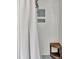 A tiled shower featuring a corner seat and built-in shampoo niches at 1310 Yarborough Dr, Peachtree City, GA 30269