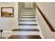 Stairway with white risers, dark-stained treads, and classic railing at 1310 Yarborough Dr, Peachtree City, GA 30269