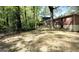 Private backyard features mature trees and a chain link fence that surrounds the property at 1655 Tryon Ne Rd, Brookhaven, GA 30319