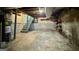 Unfinished basement space with concrete floors, exposed beams, and utility access at 1655 Tryon Ne Rd, Brookhaven, GA 30319