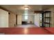 Finished basement featuring an extra room, shelving, and natural light from a pair of windows at 1655 Tryon Ne Rd, Brookhaven, GA 30319