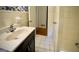 Bathroom features a white sink with chrome faucet, and tiled walls and floors at 1655 Tryon Ne Rd, Brookhaven, GA 30319