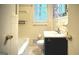 Bathroom view showcases a white tiled shower and vanity with coordinated fixtures at 1655 Tryon Ne Rd, Brookhaven, GA 30319