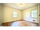 Bedroom with hardwood floors and two windows for natural light at 1655 Tryon Ne Rd, Brookhaven, GA 30319