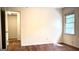 Bedroom features a window providing natural light and hardwood floors at 1655 Tryon Ne Rd, Brookhaven, GA 30319