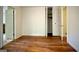 Bedroom featuring hardwood floors and an open closet at 1655 Tryon Ne Rd, Brookhaven, GA 30319