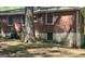 Exterior view of a brick home with a mature tree in the front yard at 1655 Tryon Ne Rd, Brookhaven, GA 30319