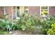 A well-kept home exterior features blooming roses and lush garden beds adding curb appeal at 1655 Tryon Ne Rd, Brookhaven, GA 30319