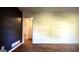Spacious living room with hardwood floors and access to other rooms at 1655 Tryon Ne Rd, Brookhaven, GA 30319