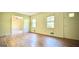 Bright living room featuring hardwood floors, windows and a doorway to another room at 1655 Tryon Ne Rd, Brookhaven, GA 30319