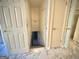 Stairs leading down to the basement with white flooring on the upper level at 1655 Tryon Ne Rd, Brookhaven, GA 30319
