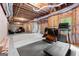 Unfinished basement featuring exposed ductwork, concrete floors, and a workout area at 190 Ridgecrest Dr, Fayetteville, GA 30215