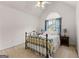 Bedroom with cathedral ceiling featuring a decorative iron bed frame and side tables at 190 Ridgecrest Dr, Fayetteville, GA 30215