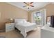 Cozy bedroom featuring a ceiling fan, neutral walls, and bright, natural light at 190 Ridgecrest Dr, Fayetteville, GA 30215