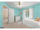 Bright, cheerful bedroom with natural light, a ceiling fan, and aqua walls at 190 Ridgecrest Dr, Fayetteville, GA 30215