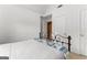 Bedroom showcasing a made bed with metal frame and overhead lighting at 190 Ridgecrest Dr, Fayetteville, GA 30215