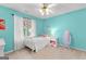 Comfortable bedroom offering neutral walls, a ceiling fan, and natural light at 190 Ridgecrest Dr, Fayetteville, GA 30215