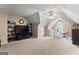 Bonus room with vaulted ceilings, built-ins, a ceiling fan, and large windows at 190 Ridgecrest Dr, Fayetteville, GA 30215