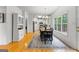 Light-filled dining room boasts hardwood floors, modern chandelier, and ample natural light at 190 Ridgecrest Dr, Fayetteville, GA 30215