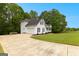 Traditional two-story home with a white exterior, attached garage, and well-manicured lawn at 190 Ridgecrest Dr, Fayetteville, GA 30215
