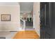 Spacious foyer showcasing hardwood floors, an open staircase, and a glimpse into the living area at 190 Ridgecrest Dr, Fayetteville, GA 30215