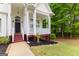 Inviting front porch with white columns and space for seating, offering a relaxing outdoor area at 190 Ridgecrest Dr, Fayetteville, GA 30215