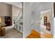 Hallway featuring the stairway, hardwood floors, and natural lighting at 190 Ridgecrest Dr, Fayetteville, GA 30215