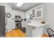 Well-lit kitchen features modern stainless steel appliances and white cabinets at 190 Ridgecrest Dr, Fayetteville, GA 30215