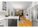 Kitchen featuring stainless steel dishwasher, white cabinets, and an island with a breakfast bar at 190 Ridgecrest Dr, Fayetteville, GA 30215