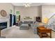 Inviting living room with a fireplace, large sectional sofa, and abundant natural light at 190 Ridgecrest Dr, Fayetteville, GA 30215