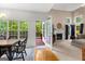 Open dining and living area features hardwood floors and plentiful natural light at 190 Ridgecrest Dr, Fayetteville, GA 30215