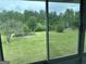 View of backyard through sunroom windows at 8315 Ridge Rd, Fairburn, GA 30213