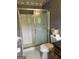 Full bathroom with a shower, toilet, and a vanity at 8315 Ridge Rd, Fairburn, GA 30213