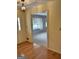 Inviting foyer with wood floors and a view into the living room at 8315 Ridge Rd, Fairburn, GA 30213