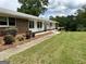 Quaint one-story home with brick accents and a well-kept front yard at 8315 Ridge Rd, Fairburn, GA 30213