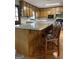 Spacious kitchen with wood cabinets and countertops, and wooden chairs at 8315 Ridge Rd, Fairburn, GA 30213