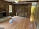 Open living room with hardwood floors and traditional wood accents at 8315 Ridge Rd, Fairburn, GA 30213