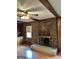 Spacious living room featuring a brick fireplace and wood trim at 8315 Ridge Rd, Fairburn, GA 30213