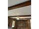 Living room view showcasing wood beam ceilings and natural light at 8315 Ridge Rd, Fairburn, GA 30213