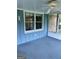 Enclosed sunroom with air conditioner, carpeted floor and a view of the yard at 8315 Ridge Rd, Fairburn, GA 30213