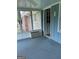 Enclosed sunroom with air conditioner, carpeted floor and a view of the yard at 8315 Ridge Rd, Fairburn, GA 30213