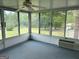 Enclosed sunroom with a view of the yard at 8315 Ridge Rd, Fairburn, GA 30213