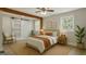 Serene bedroom with a cozy bed, a sliding barn door, and a neutral color palette at 3650 Adkins Nw Rd, Atlanta, GA 30331