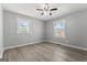 A bright bedroom offers natural light with hardwood floors and neutral walls, creating a relaxing atmosphere at 3650 Adkins Nw Rd, Atlanta, GA 30331