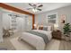 Relaxing bedroom featuring a comfortable bed, wood floors, and a sliding barn door closet at 3650 Adkins Nw Rd, Atlanta, GA 30331