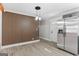 Dining area with a stainless steel refrigerator and a contemporary light fixture above the dining space at 3650 Adkins Nw Rd, Atlanta, GA 30331