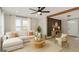 Inviting living room with a cozy sectional sofa, modern decor, and ample natural light at 3650 Adkins Nw Rd, Atlanta, GA 30331