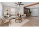 Bright living room featuring modern furniture, wood floors, and abundant natural light at 3650 Adkins Nw Rd, Atlanta, GA 30331